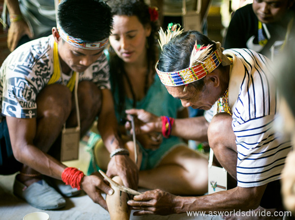 Mentawai 'sipatitik' tattoo artists perform traditional handtapping at the Indigenous Celebration Festival in Ubud, Bali