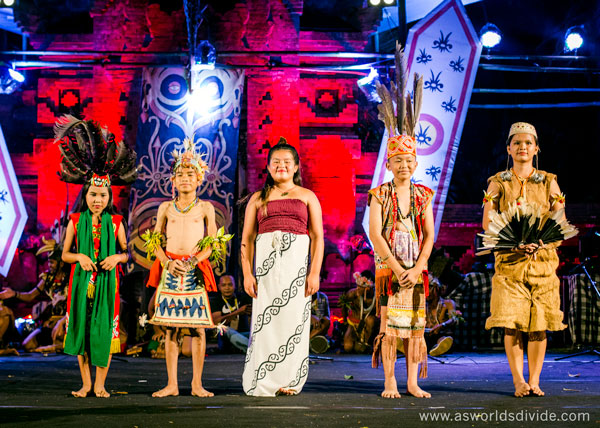 Student from the Suku Mentawai Education Foundation's cultural program performs a collaborative dance with children from other cultures at the Indigenous Celebration Festival in Ubud, Bali