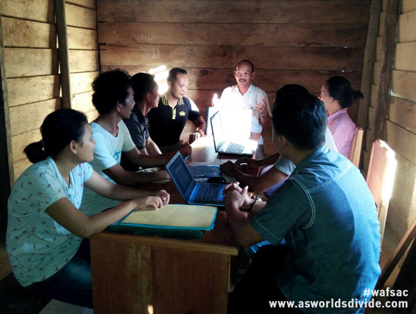 The team at Yayasan Pendidikan Suku Mentawai discuss strategy in Siberut